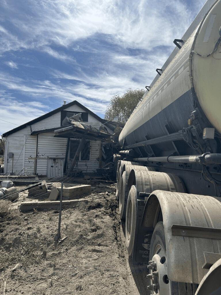 Loaded Tanker Truck Travels Off Highway 6, Runs Into Home, Injuring Occupants