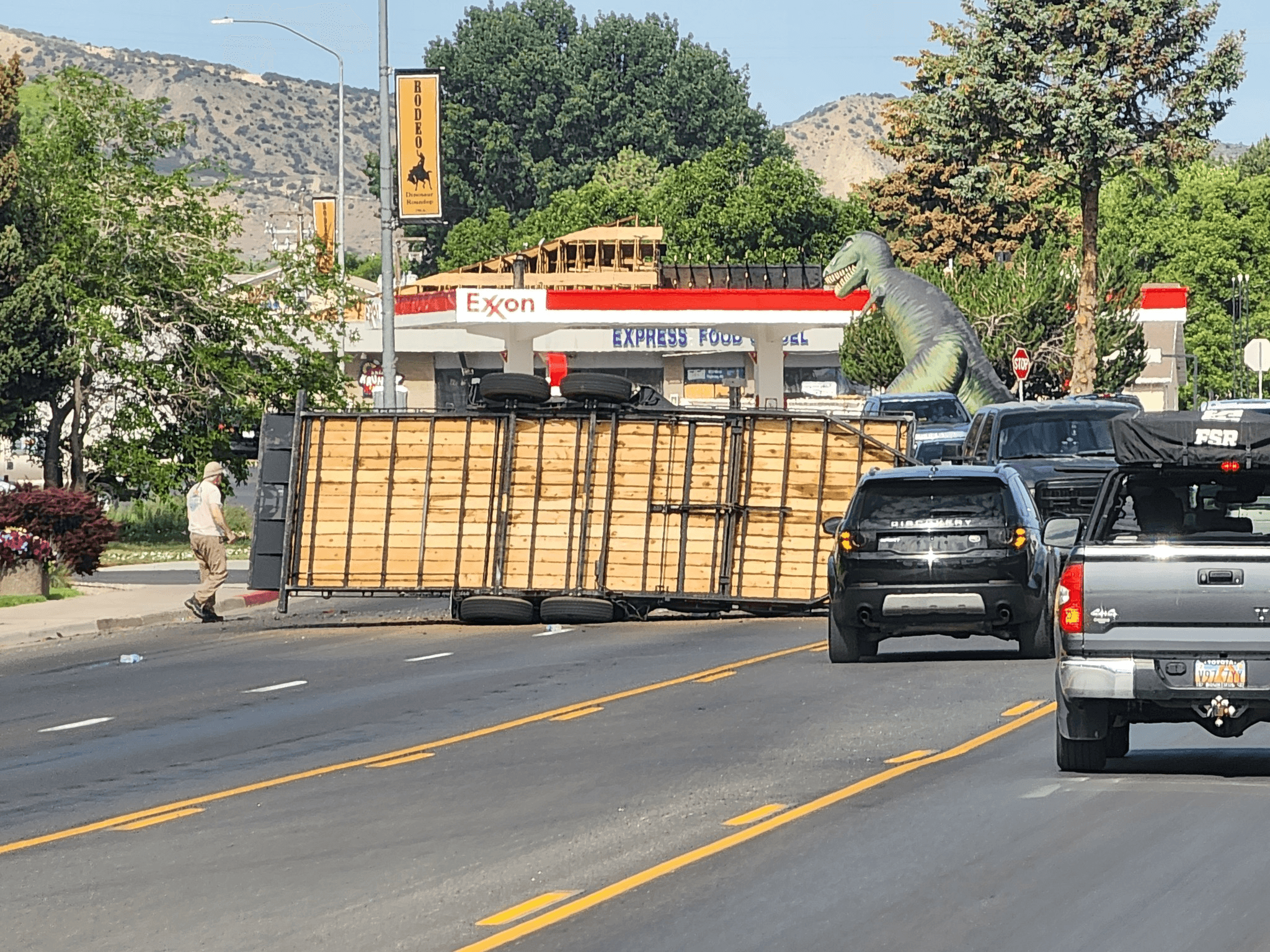 Cut Off Trailer Hauling Skid Steer Flips On Side; Blocks Traffic